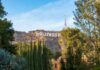 Hollywood Sign on hillside framed by trees