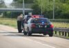 Gold Heist Busted on I-80 Police officer conducting a traffic stop on a highway