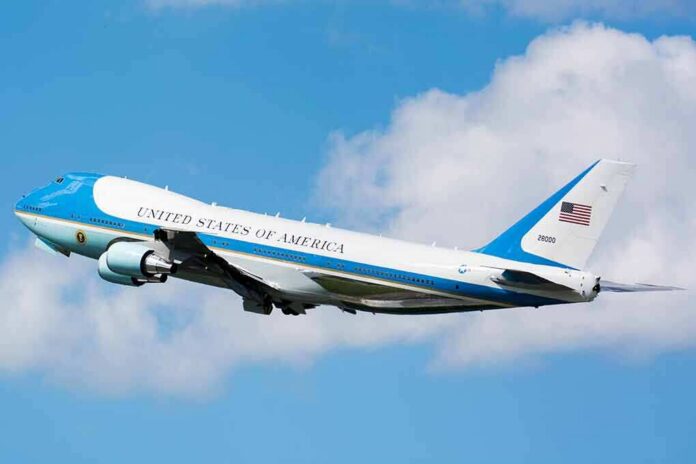 Air Force One aircraft ascending against a blue sky