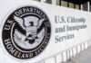 USCIS building exterior sign with DHS seal