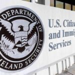 DHS Faces Pressure To Deliver Mass Deportations USCIS building exterior sign with DHS seal