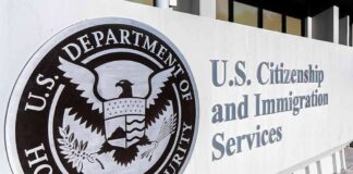 USCIS building exterior sign with DHS seal
