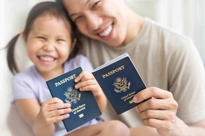 shutterstock_1575922960 Smiling child and adult holding passports