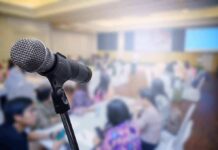 microphone on stand in a blurred conference room