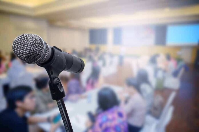 microphone on stand in a blurred conference room