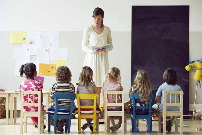 Teacher reading to children seated in a classroom