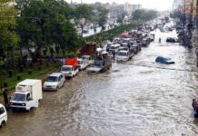 Nepal Flood Death TOLL Surges Past 900 Flooded city street with stranded vehicles and traffic jam