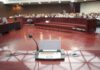 Silent T-Shirts Trigger Capitol Hearing Clash Conference microphone on a podium in a courtroom
