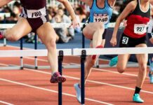 Why 2,293 Medals Became a Sports Flashpoint” Female athletes clearing hurdles on a track