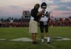 Nation-Leading Streak SHATTERED In 30 Seconds football coach with arm around player number 84 on sideline