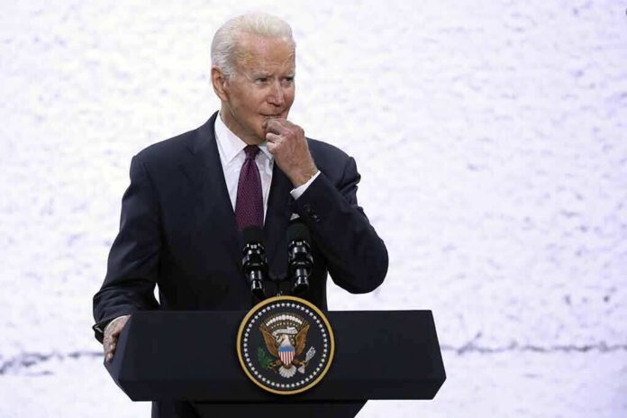 shutterstock_2075708479 man at presidential podium with microphones