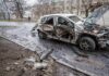 Ukraine Downs 175 Targets In Barrage burned-out car with severe damage on a city street