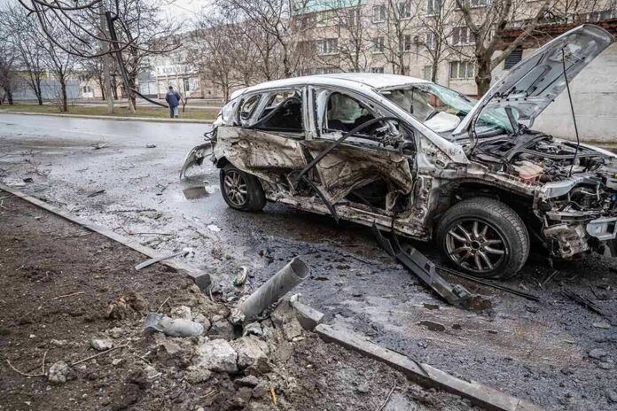 shutterstock_2137424657-5 burned-out car with severe damage on a city street