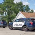 Inside The Mechanicville Family Murder-Suicide Two police SUVs parked near a suburban house