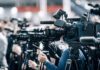 Infant Death Case Turns On Medical Evidence Broadcast cameras on tripods at a press event