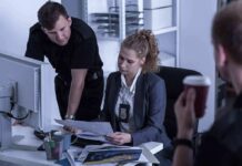 Independent Journalism Faces A Trust Problem Police officers reviewing documents at a desk