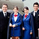 Airline crew standing together on the tarmac