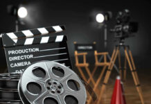 Affleck’s Quiet AI Play Shakes Hollywood Movie set with film reels and clapperboard.