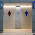 Public restroom entrance with male and female symbols
