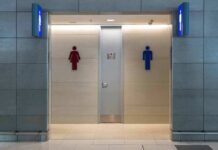 Gender-Neutral Shift Hides a Bigger Pivot Public restroom entrance with male and female symbols