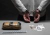 ‘Bible’ Bomb Manual Sparks Terror Case person in handcuffs behind back over table with seized packages