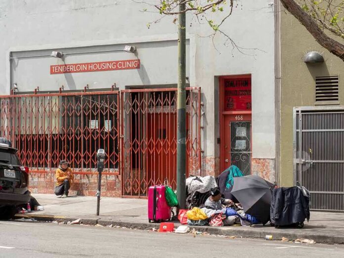 shutterstock_1094612630-1 Demetrius McCray outside Tenderloin Housing Clinic with belongings on sidewalk
