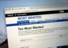 Computer screen showing an FBI Most Wanted webpage
