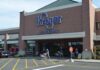 Kroger storefront with shoppers and carts