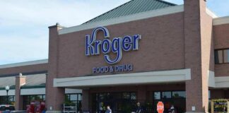Kroger storefront with shoppers and carts