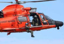 Rescue Arcs Expand – 11 Still Vanish Rescue helicopter with crew performing hoist operation