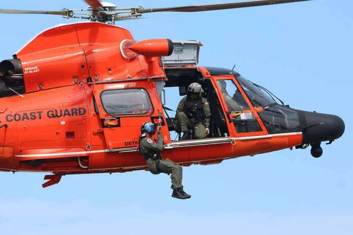 shutterstock_1496219480-2 Rescue helicopter with crew performing hoist operation