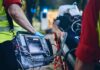 Gruesome Fall Floors Ric Flair Paramedic with defibrillator beside patient on stretcher