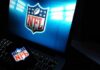 NFL logo on laptop screen and smartphone