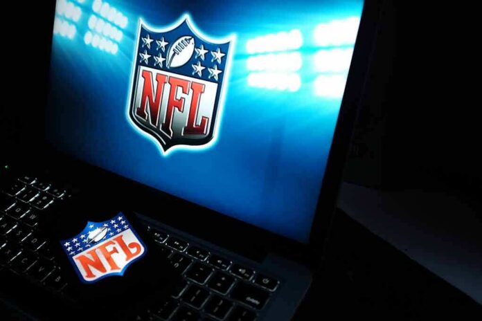 NFL logo on laptop screen and smartphone