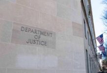 Campus Threats Trigger Federal Takedown Department of Justice building exterior with American flags