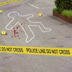 crime scene with body outline and police tape