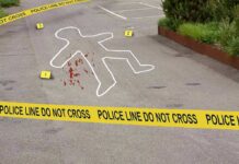 Parking-Lot Hit? In-Laws Caught on Video crime scene with body outline and police tape