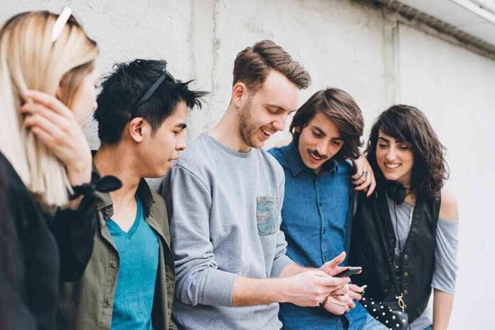 Group of friends looking at a smartphone