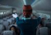 Celebrity Air Rage Sparks FBI Probe Flight attendant giving safety demonstration in airplane aisle