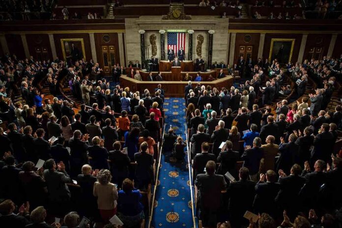 Legislative chamber audience stands and applauds