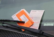 parking ticket under windshield wiper