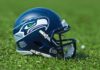 American football helmet on grass