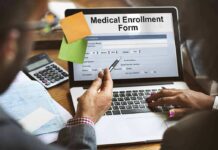 An Address Link Is Not Proof of Fraud Laptop displaying a medical enrollment form with two people reviewing it