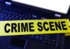 Recorded Call Flips UA Case Laptop keyboard with yellow crime scene tape across it